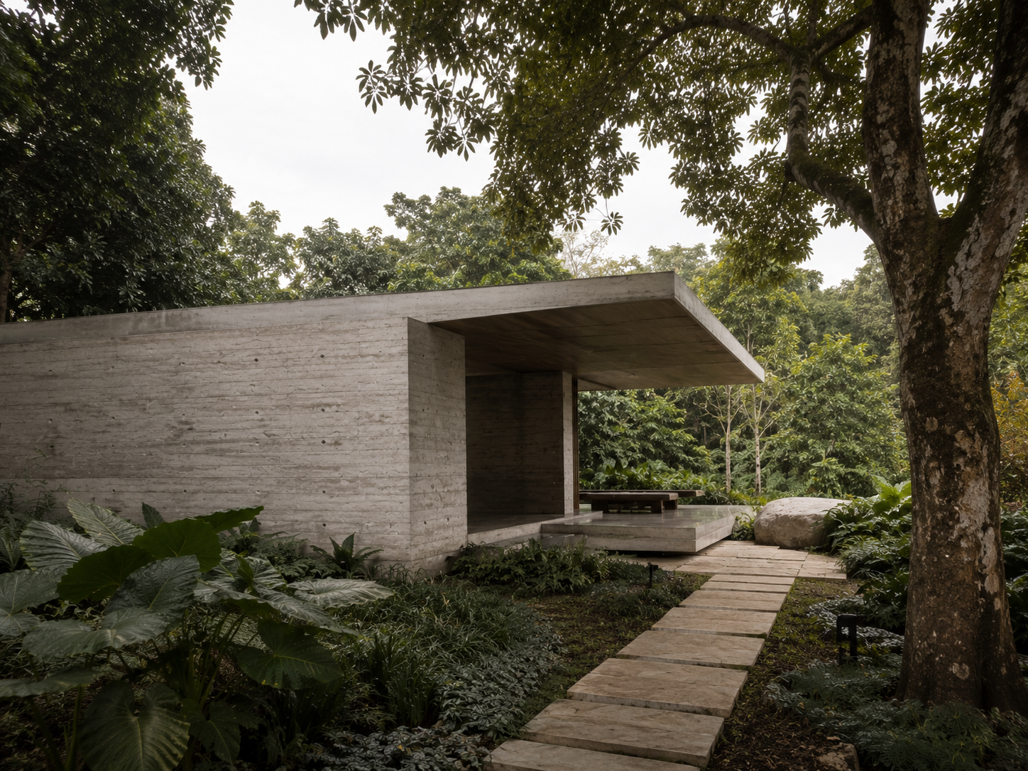 Minimal concrete pavilion integrated into a landscaped garden